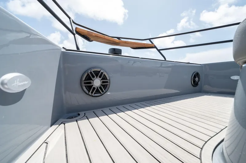  Yacht Photos Pics 2025 Hanover 387 boat deck with speakers and sleek design under blue sky.