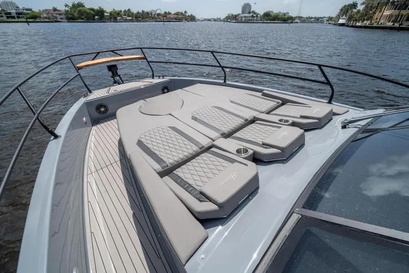  Yacht Photos Pics Luxurious 2025 Hanover 387 yacht with sunbathing deck on a scenic waterway.