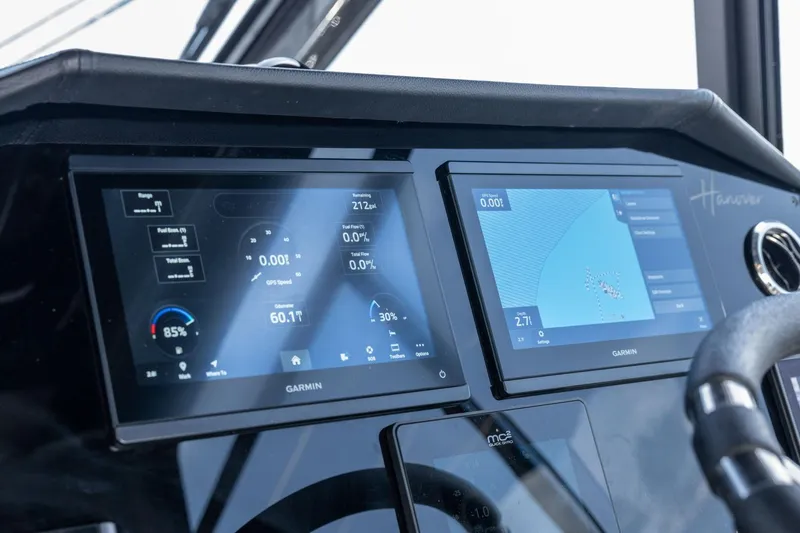  Yacht Photos Pics Dashboard of 2025 Hanover 387 boat with dual Garmin displays showing navigation and performance data.