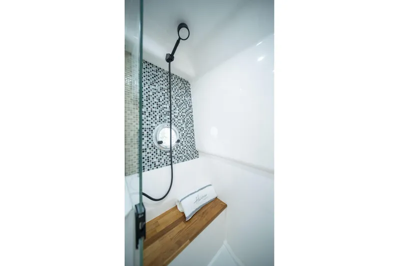  Yacht Photos Pics Modern shower with mosaic tiles and wooden bench in Hanover 387, 2025 model.