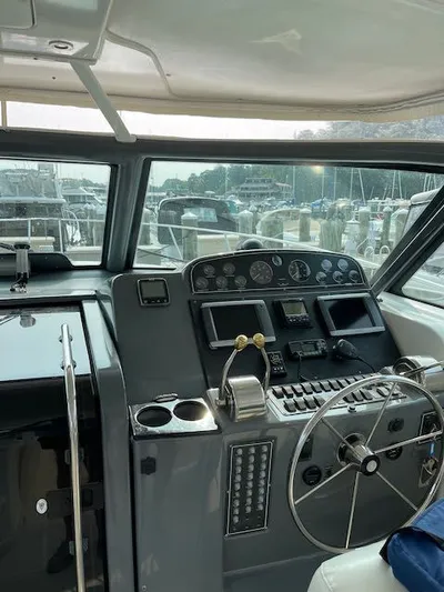  Yacht Photos Pics Cockpit of 2000 Tiara Yachts 38 Open, featuring steering wheel and control panel.