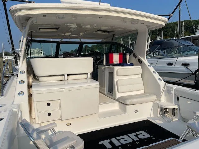  Yacht Photos Pics 2000 Tiara Yachts 38 Open, spacious deck, luxurious seating, docked at marina.