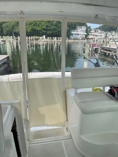  Yacht Photos Pics Interior view of 2000 Tiara Yachts 38 Open, overlooking marina with fishing rods.