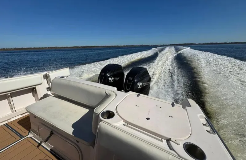  Yacht Photos Pics 2003 Grady-White Marlin 300 boat with twin engines cruising on open water.