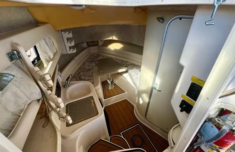  Yacht Photos Pics 2003 Grady-White Marlin 300 cabin interior with kitchenette and seating area.