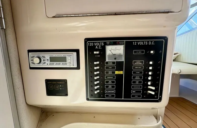 Yacht Photos Pics Control panel of a 2003 Grady-White Marlin 300 boat, featuring AC and DC switches.