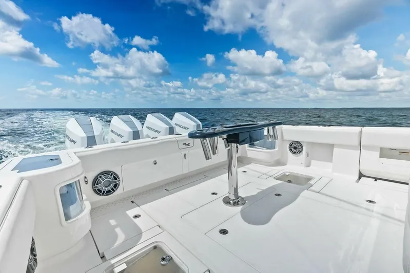 Fish Wish Yacht Photos Pics 2023 SeaVee 450z boat deck with ocean view, featuring multiple Mercury engines.