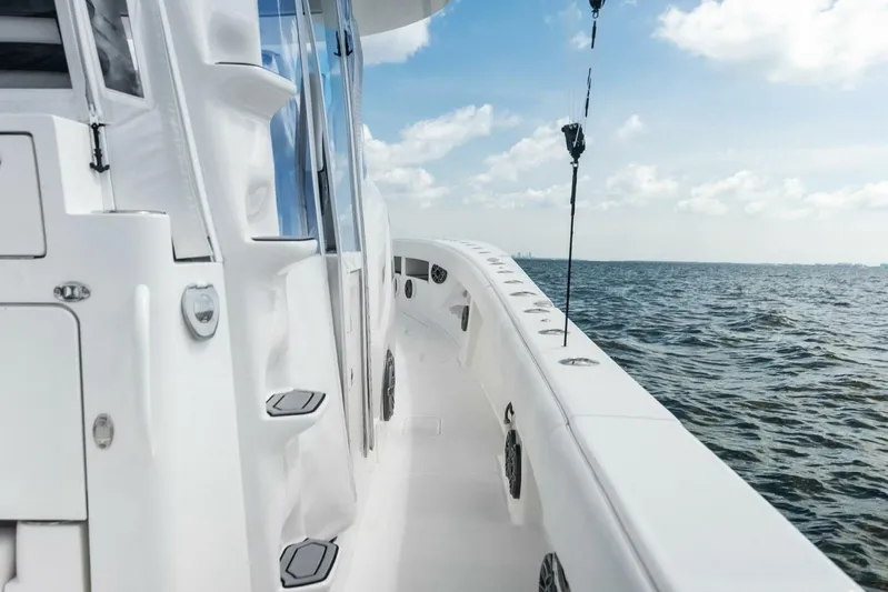 Fish Wish Yacht Photos Pics 2023 SeaVee 450z boat deck with ocean view under blue sky.