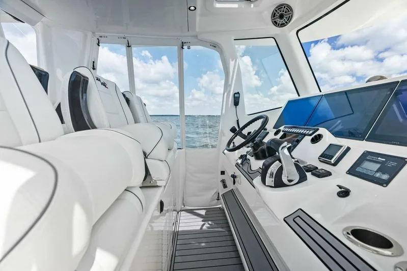 Fish Wish Yacht Photos Pics Interior of 2023 SeaVee 450z boat with modern helm and luxurious seating.