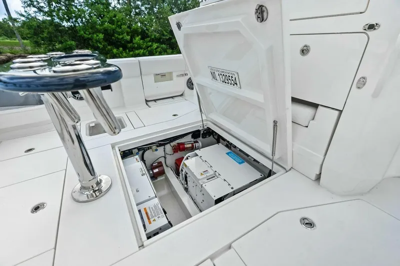 Fish Wish Yacht Photos Pics 2023 SeaVee 450z boat deck with open hatch revealing storage and equipment.