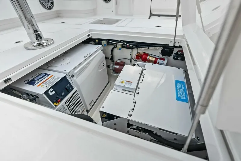 Fish Wish Yacht Photos Pics 2023 SeaVee 450z engine compartment with generator and fire extinguisher.