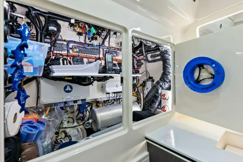 Fish Wish Yacht Photos Pics 2023 SeaVee 450z engine room with complex wiring and equipment.