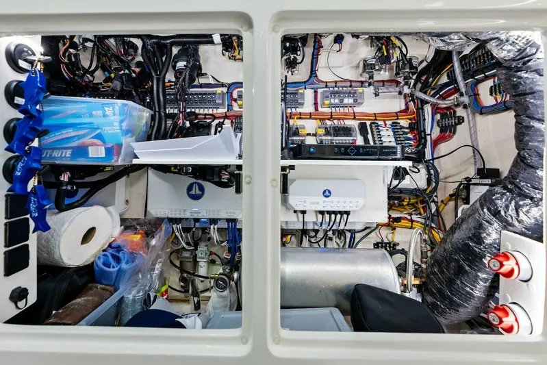 Fish Wish Yacht Photos Pics Engine room of 2023 SeaVee 450z boat, showcasing complex wiring and equipment.