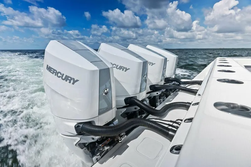 Fish Wish Yacht Photos Pics 2023 SeaVee 450z boat with four Mercury outboard engines on open water.