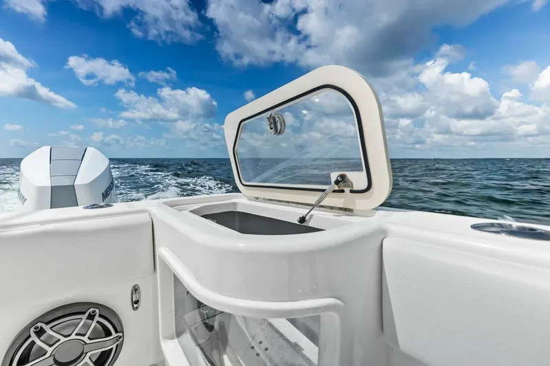 Fish Wish Yacht Photos Pics 2023 SeaVee 450z boat with open hatch, ocean view, and clear blue sky.