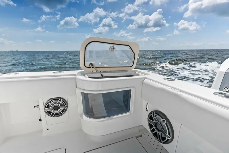 Fish Wish Yacht Photos Pics 2023 SeaVee 450z boat interior with open hatch, ocean view, and speakers.