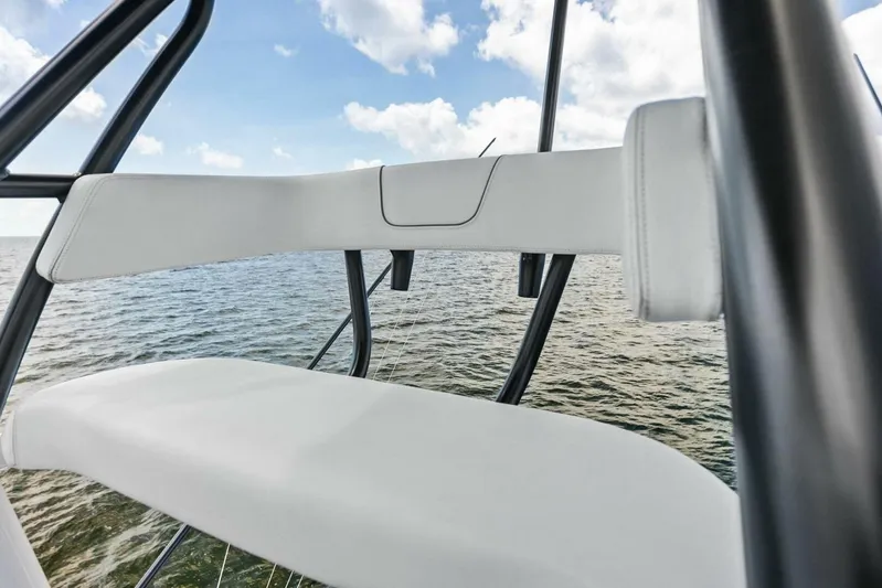 Fish Wish Yacht Photos Pics 2023 SeaVee 450z boat seating with ocean view and blue sky.