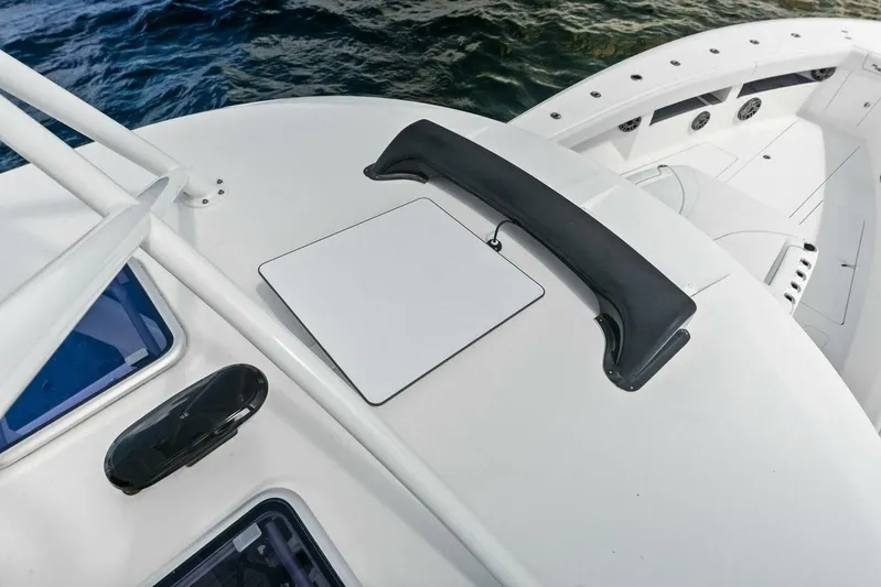 Fish Wish Yacht Photos Pics 2023 SeaVee 450z boat deck with sleek design and ocean view.