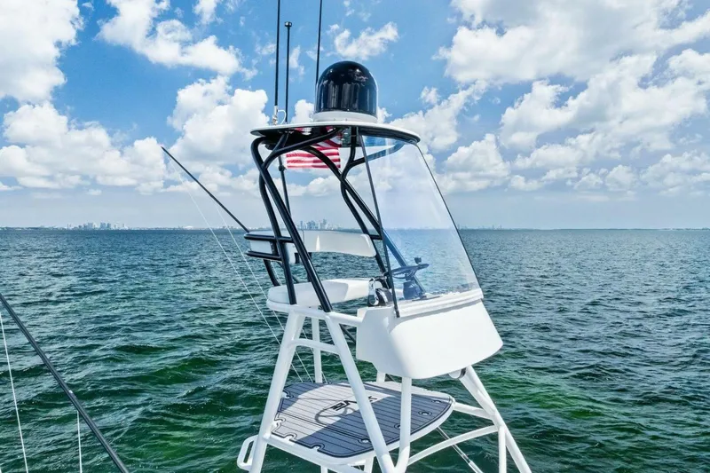 Fish Wish Yacht Photos Pics 2023 SeaVee 450z boat tower with ocean view and American flag.