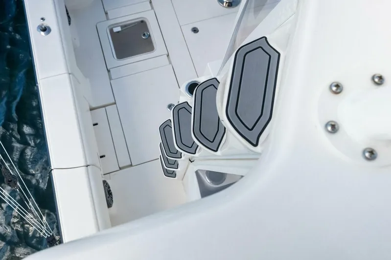 Fish Wish Yacht Photos Pics 2023 SeaVee 450z boat deck with non-slip steps and water view.