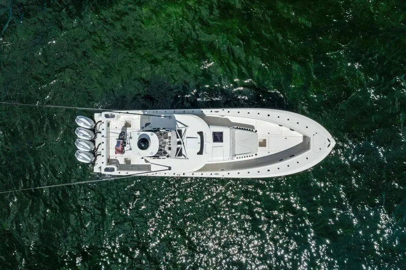 Fish Wish Yacht Photos Pics Aerial view of 2023 SeaVee 450z boat on green water.