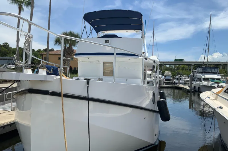 Lone Star (former/recently Andros) Yacht Photos Pics 2008 Great Harbour N37 yacht docked at marina under clear blue sky.
