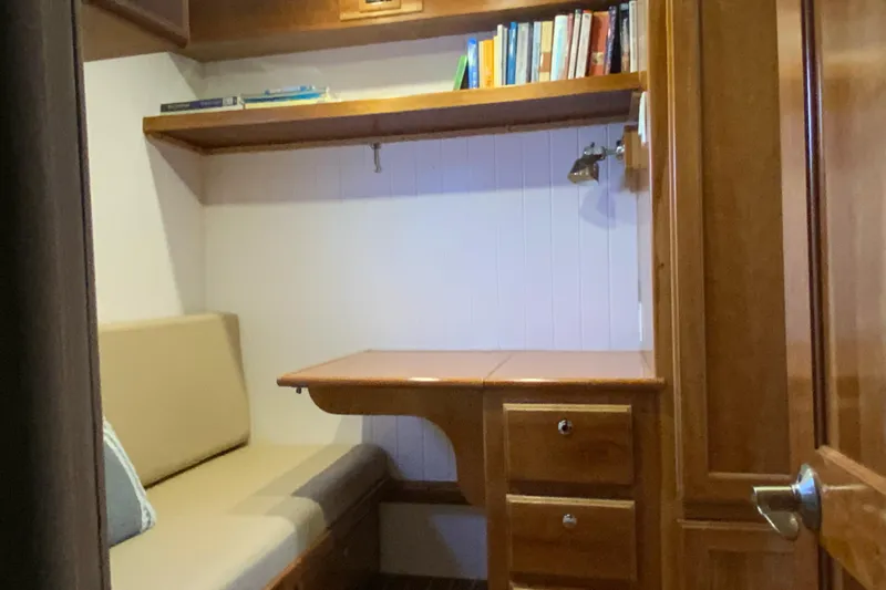 Lone Star (former/recently Andros) Yacht Photos Pics Cozy study nook in 2008 Great Harbour N37 boat with wooden desk and shelves.