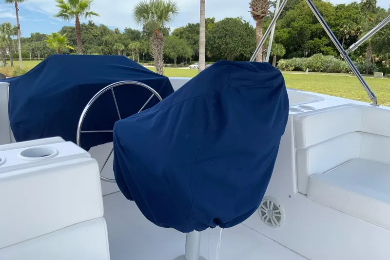Lone Star (former/recently Andros) Yacht Photos Pics 2008 Great Harbour N37 yacht helm with blue covers, outdoor setting.