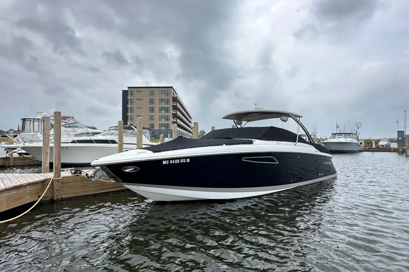  Yacht Photos Pics 2015 Cobalt 336 boat docked at marina under cloudy skies.
