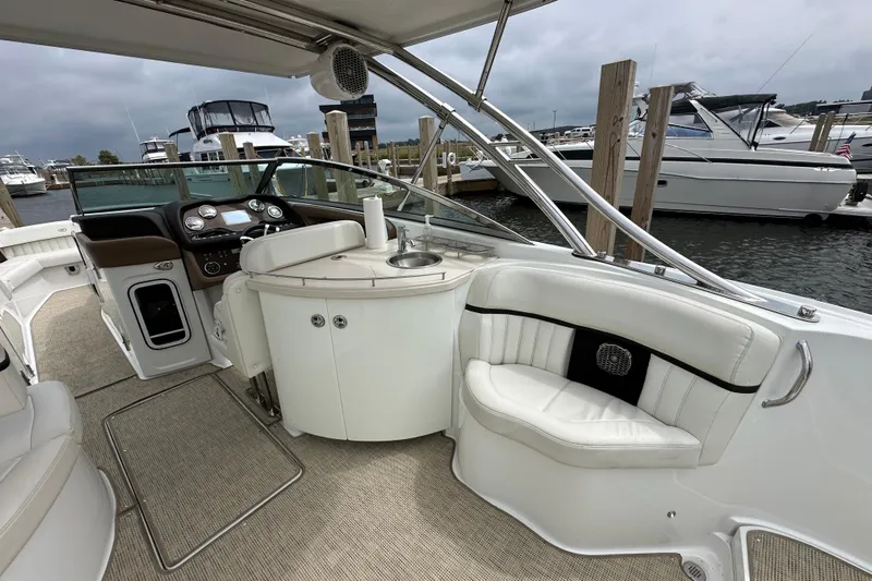  Yacht Photos Pics Interior of a 2015 Cobalt 336 boat with luxurious seating and control panel.