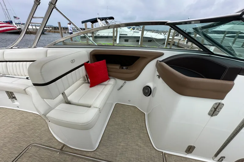  Yacht Photos Pics 2015 Cobalt 336 boat interior with white seating and red cushion at dock.