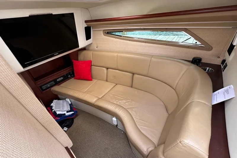  Yacht Photos Pics Luxurious interior of 2015 Cobalt 336 boat with leather seating and TV.