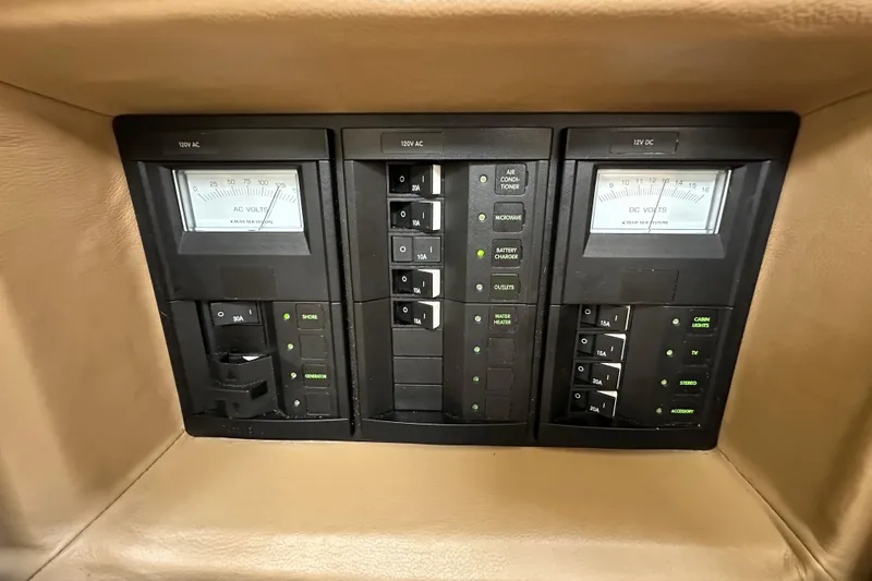  Yacht Photos Pics Control panel of a 2015 Cobalt 336 boat with AC and DC voltage meters.