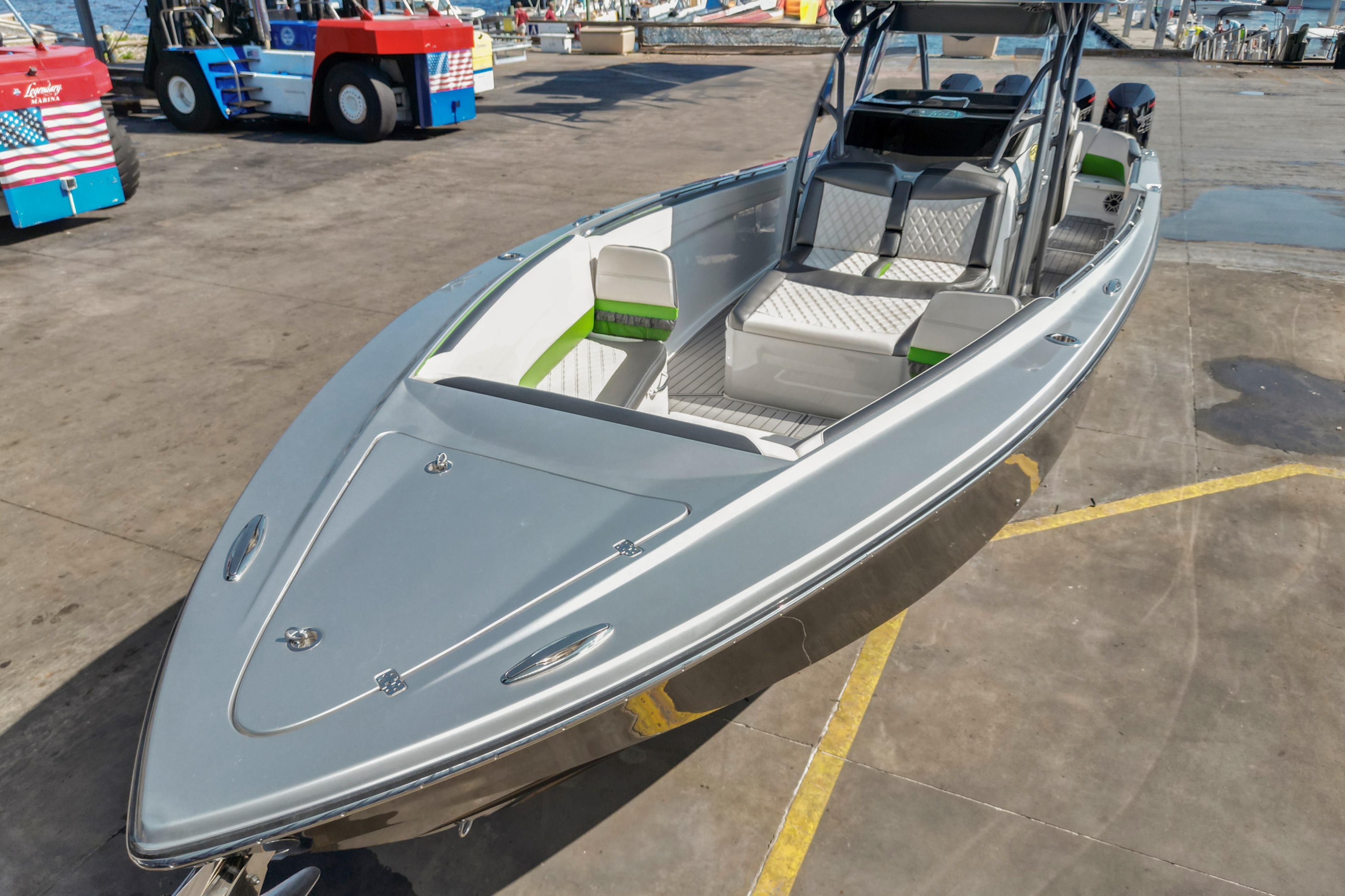 2021 Nor-Tech 390 Sport Center Console boat docked, showcasing sleek design and spacious seating.