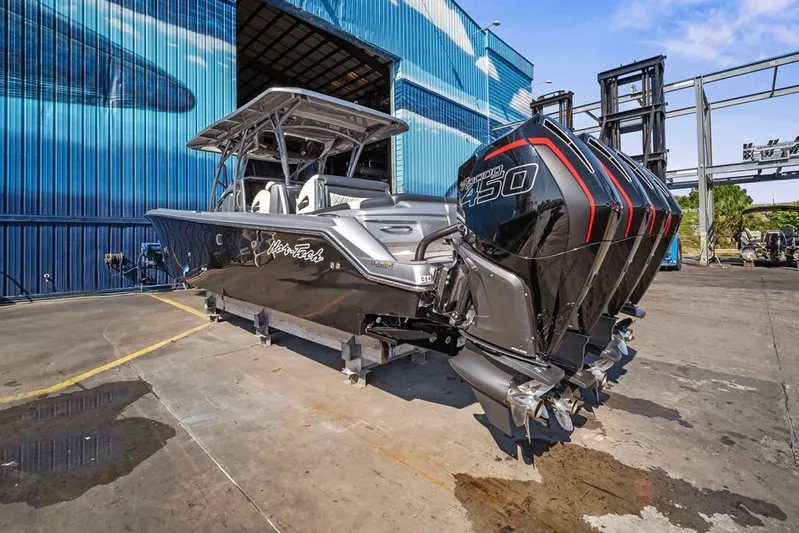  Yacht Photos Pics 2021 Nor-Tech 390 Sport Center Console boat with powerful engines, docked outdoors.