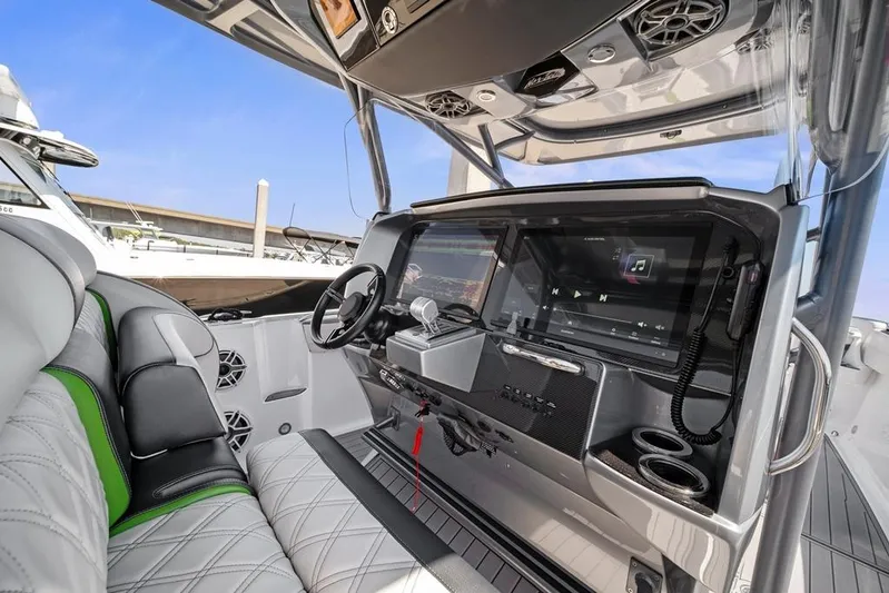  Yacht Photos Pics 2021 Nor-Tech 390 Sport Center Console interior with modern dashboard and luxurious seating.