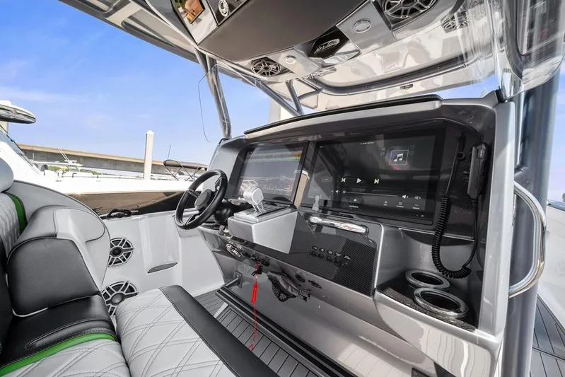  Yacht Photos Pics 2021 Nor-Tech 390 Sport Center Console interior with advanced navigation and audio system.