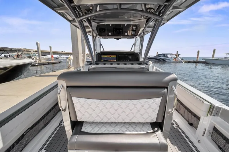  Yacht Photos Pics 2021 Nor-Tech 390 Sport Center Console at marina, showcasing helm and seating.