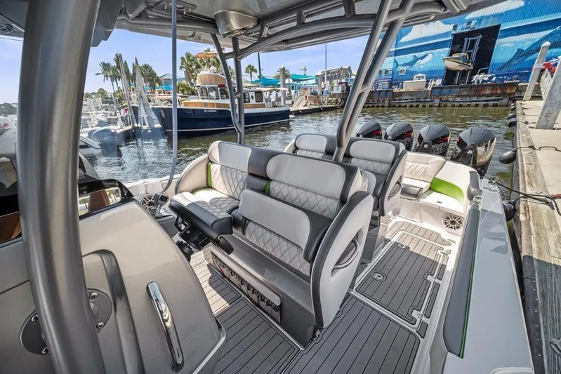  Yacht Photos Pics 2021 Nor-Tech 390 Sport Center Console boat interior with luxurious seating and multiple outboard engines.