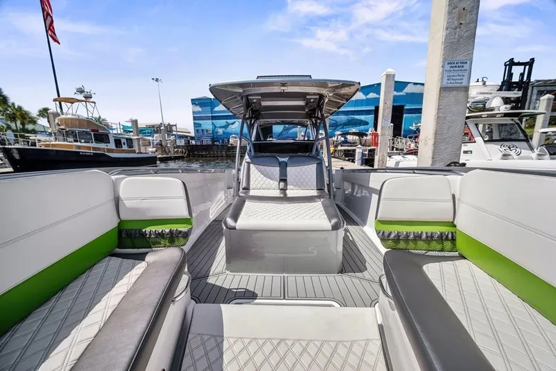  Yacht Photos Pics 2021 Nor-Tech 390 Sport Center Console boat with stylish seating and modern design at a marina.
