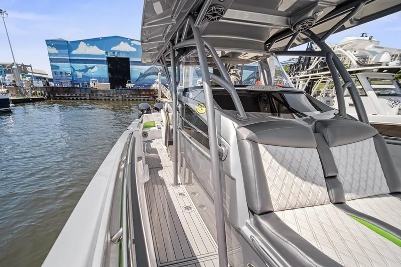  Yacht Photos Pics 2021 Nor-Tech 390 Sport Center Console boat docked, showcasing sleek design and spacious seating.