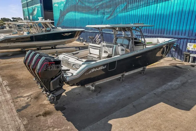  Yacht Photos Pics 2021 Nor-Tech 390 Sport Center Console boat with quad engines, docked outdoors.
