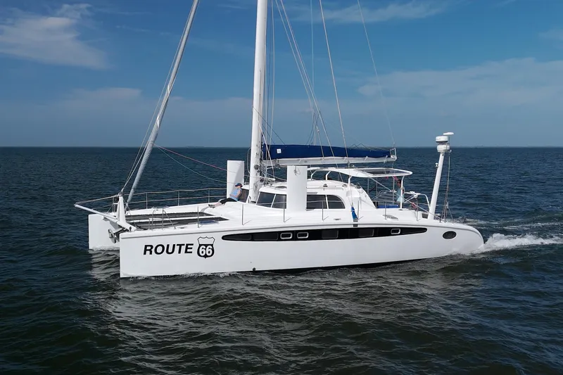 Route 66 Yacht Photos Pics 2005 Dolphin 460 Sail Catamaran "Route 66" sailing on open water.