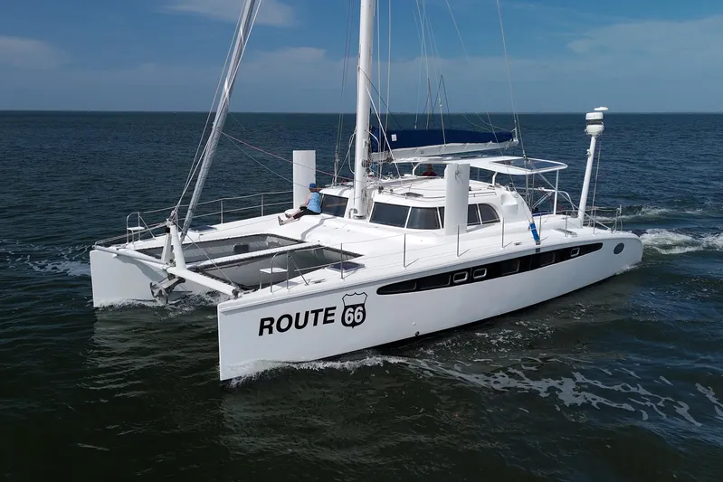Route 66 Yacht Photos Pics 2005 Dolphin 460 Sail Catamaran "Route 66" cruising on open water.