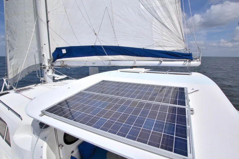 Route 66 Yacht Photos Pics Sailing catamaran with solar panels, Dolphin 460 Sail Cat, 2005 model, on open water.