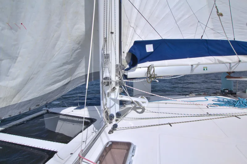 Route 66 Yacht Photos Pics 2005 Dolphin 460 Sail Catamaran with sails up, showcasing deck and rigging details.