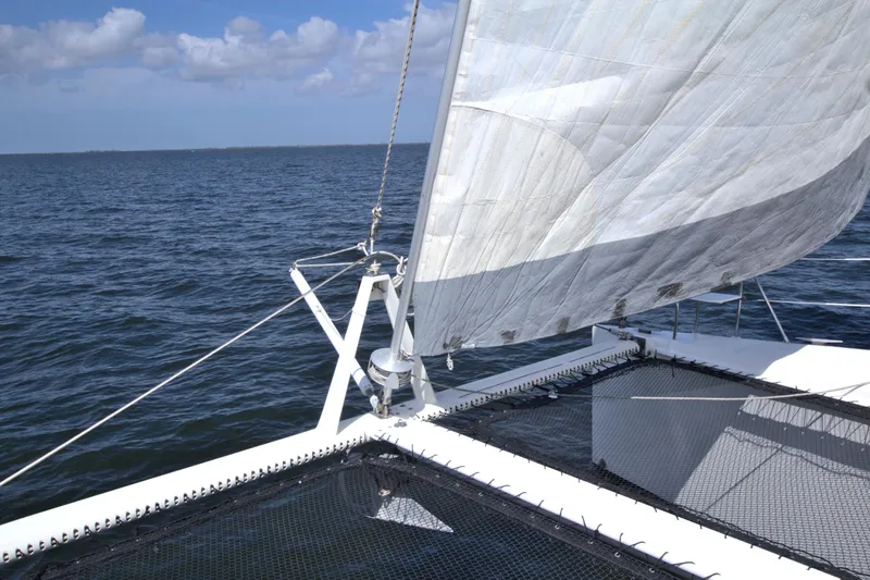 Route 66 Yacht Photos Pics Sailing on a 2005 Dolphin 460 Sail Catamaran with open sea and clear skies.