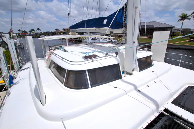 Route 66 Yacht Photos Pics 2005 Dolphin 460 Sail Catamaran docked, showcasing sleek design and spacious deck.