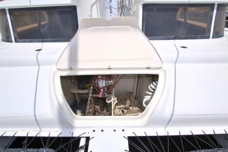 Route 66 Yacht Photos Pics 2005 Dolphin 460 Sail Cat with open storage compartment, showcasing ropes and equipment.