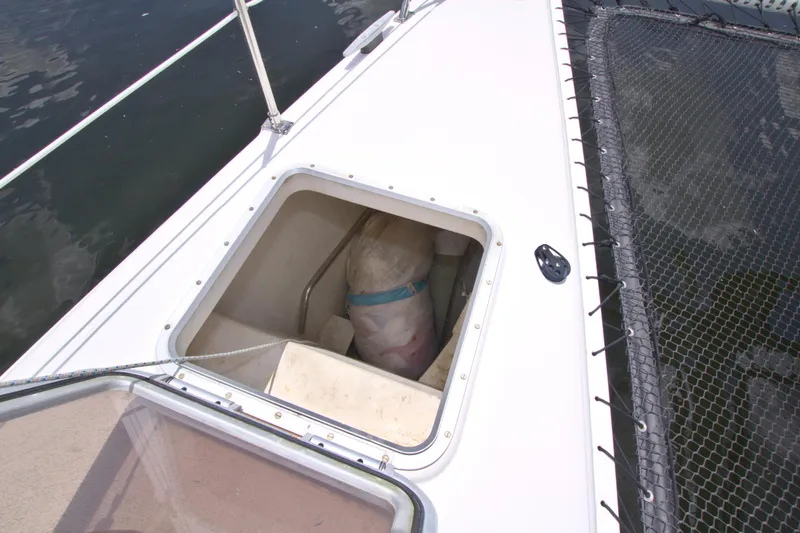 Route 66 Yacht Photos Pics Hatch on 2005 Dolphin 460 Sail Catamaran, open with storage compartment visible.